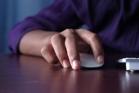 close up of man hand use computer mouse.の写真素材