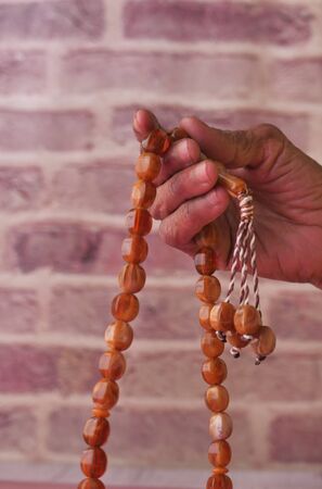 Muslim senior women hand praying on ramadanの写真素材