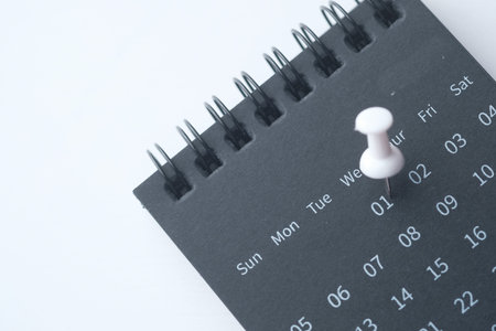 deadline concept with push pin on calendar dateの写真素材