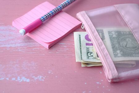 Close up of cash in pink color walletの写真素材