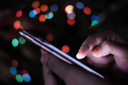 Close up of women use smart phone at nightの写真素材