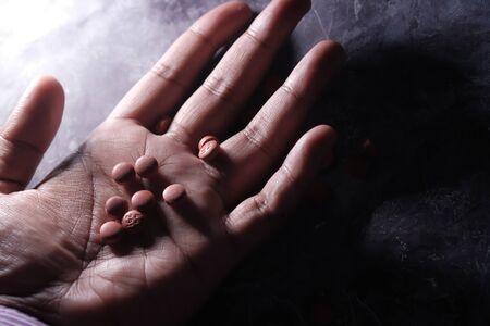 Drug and cooked heroin on man handの写真素材