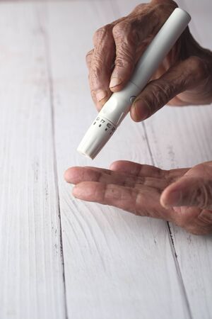 Close up of senior women measuring diabeticの写真素材