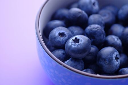 Close up of fresh blue berry in a bowl.の写真素材