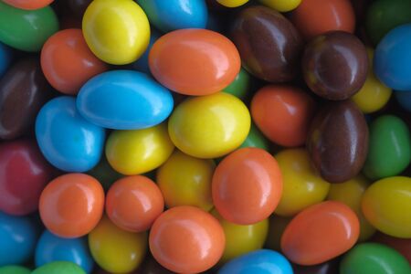 top view of colorful chocolate in a jarの写真素材