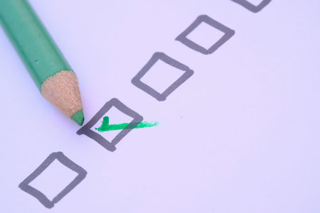 check mark on paper with green pen