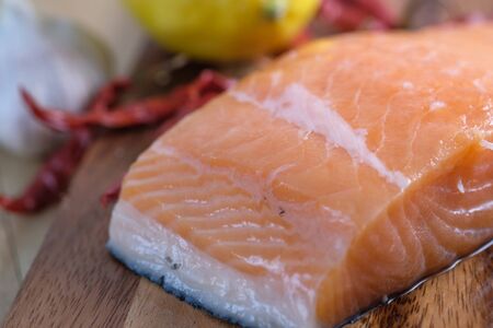 Fresh raw salmon fillets on white background.の写真素材