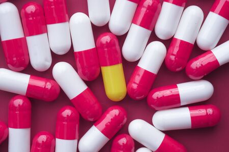 colorful pills and drugs background. Medicinal tablets capsules pills.の写真素材