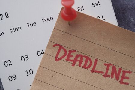 deadline concept with push pin on calendar dateの写真素材