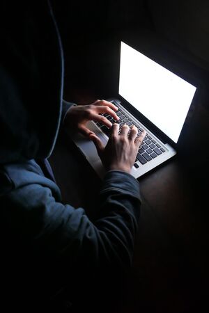 hacker stealing data from laptop, close up .の写真素材