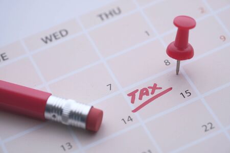 Tax day concept. The USA tax due date marked on the calendarの写真素材