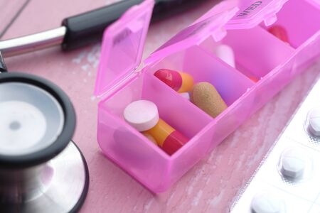selective focus. Close up of colorful pills in a pill box .の写真素材