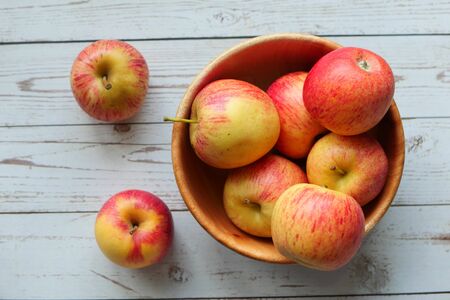 top view of red apple in a bowl on table.の写真素材