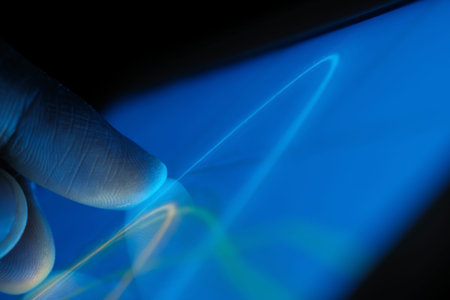 Close up of man hand analyzing chart on digital tabletの写真素材