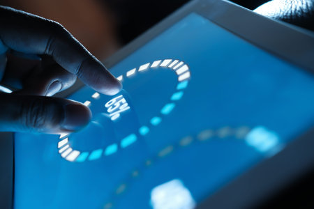 Close up of man hand analyzing chart on digital tablet
