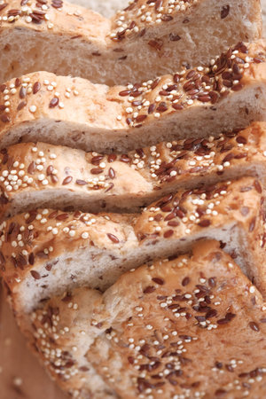 Sliced whole grain bread with oat flakes. Wholemeal bread.