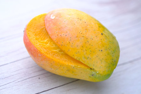 Close up of ripe mango on white background.