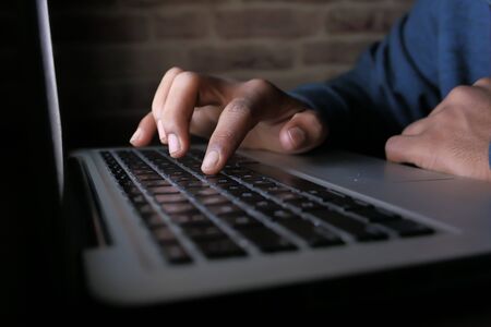 hacker stealing data from laptop, close up .の写真素材