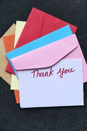 top view of thank you message on colorful envelope .の写真素材