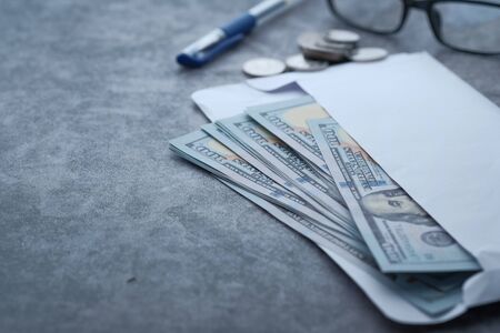 Close up of cash in a wallet on tableの写真素材
