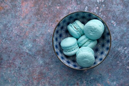 Close up of blue color macaroon in a bowlの写真素材
