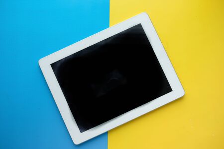 top view of digital tablet on color background.の写真素材
