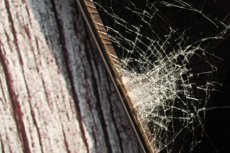 Close up of broken smart phone wooden table