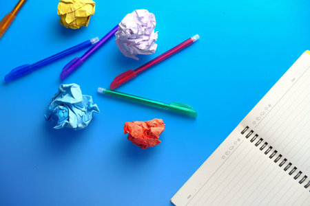 top view of crumpled paper ball on color background .