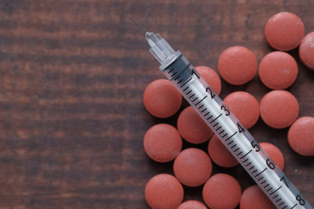 Close up of syringe, pills with copy spaceの写真素材