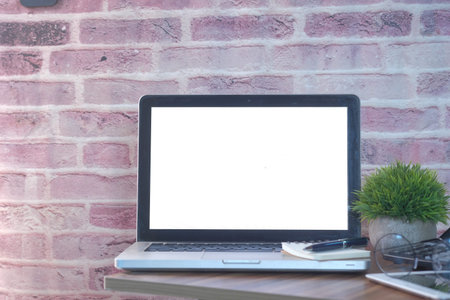 laptop with white screen on office table
