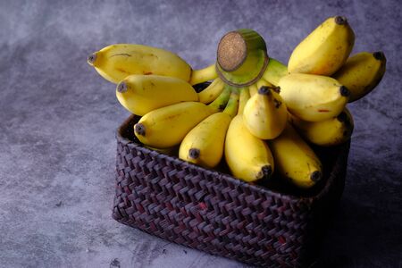 Fresh bananas in a wooden box. Top view. copy spaceの写真素材