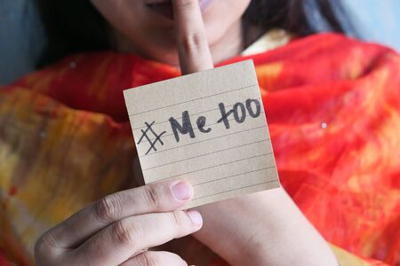 asian woman showing a note with the text me tooの写真素材