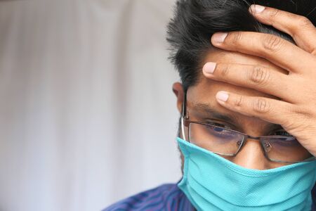 Man is wearing mask to prevent the infectious coronavirus.の写真素材