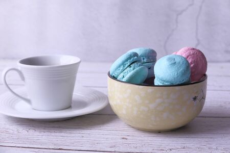 Close up of blue and pink color macaroon in a bowlの写真素材