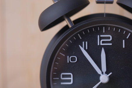 black vintage alarm clock isolated