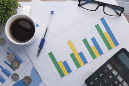 Close up of financial chart and pen on table