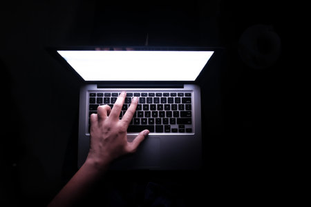 Close up of hacker hand stealing data