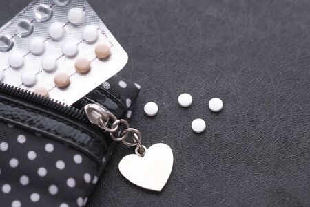 top view of birth control pill in a bag on tableの写真素材