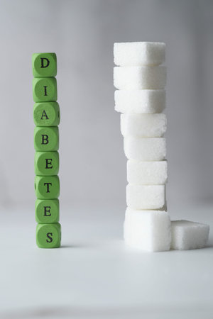 the concept of blood sugar measurement with sugar cube and wordsの写真素材