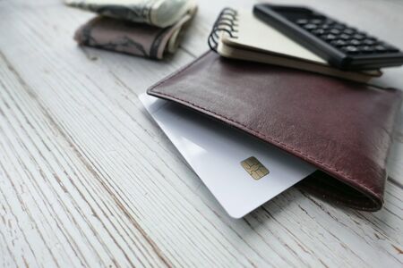 credit card in a wallet on wooden table.の写真素材