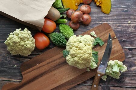 high angle view of fresh vegetable on chopping board.の写真素材