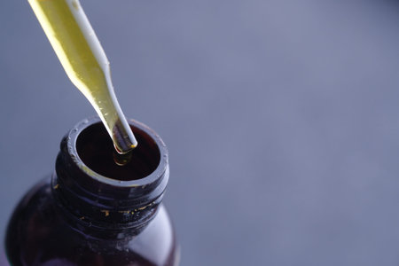 dispensing drops of healthy herbal medicinal oil