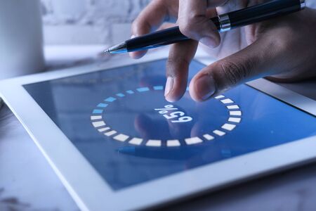 businessman analyzing financial data on digital tabletの写真素材