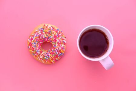 high angle view of donuts and coffee on table.の写真素材