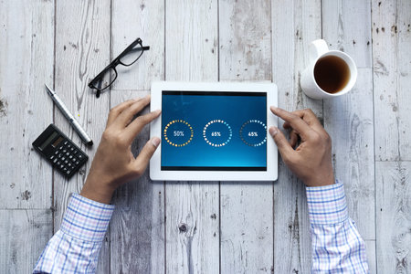 businessman analyzing financial data on digital tablet