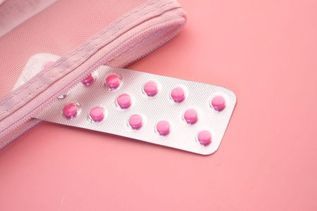 close up of pink pills in a blister pack