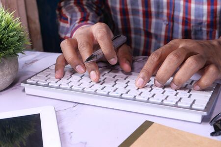 Close up of person hand typing keyboard.の写真素材