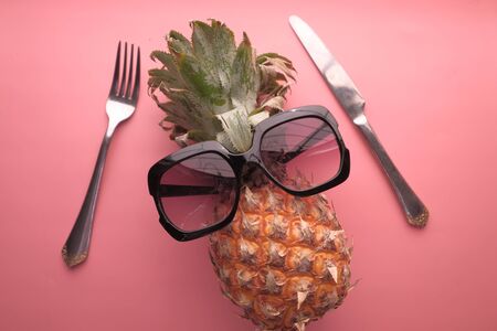 Funny pineapple with sunglasses, close upの写真素材