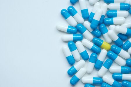 white and blue color capsule on white backgroundの写真素材