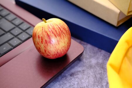 back to school concept with apple and school bag on tableの写真素材